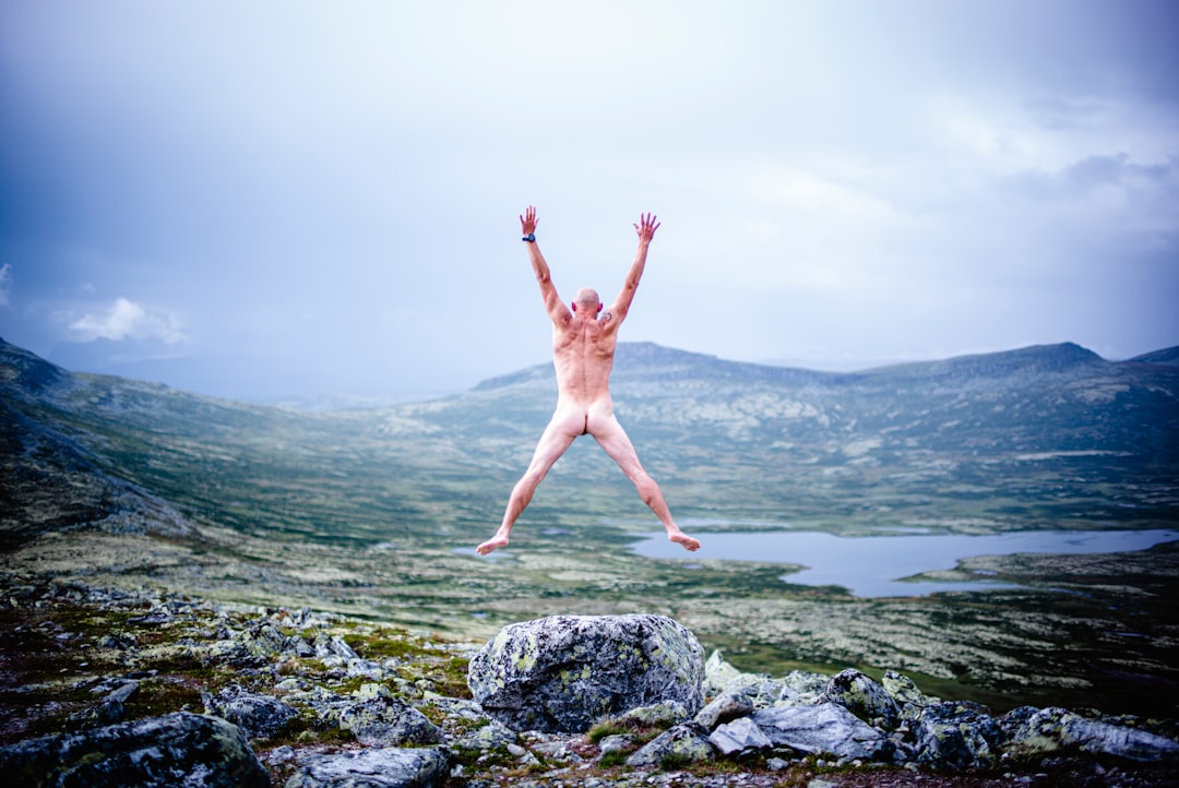 services-01 Nude Man jumping at Rondane National Park, Dovre, Sweden.